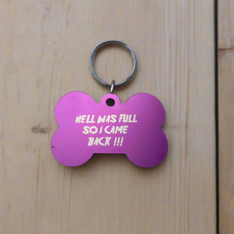 a dog id tag with a funny text