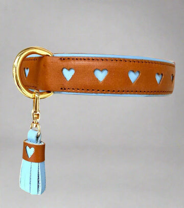 Introducing our newest addition to the DELUXE collar collection - the handcrafted collar with a charming hearts design. Made from premium leather, this collar not only looks cute but also ensures durability. Complete the set with our matching adjustable leash. Elevate your pet's style game today!