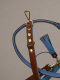 Unleash unparalleled luxury with the DELUXE Adjustable Leash by Cavlicious. Made until with the finest buttersoft leather, each leash is a masterpiece in quality and style. The leash is fully adjustable to offer ultimate comfort and control while presenting a look that's effortlessly chic. True Pet owners demand only the best for their cherished companions.

This adjustable leash is made from buttery soft leather and has multiple D-rings. The leash can be worn handsfree around the hips or shoulder.