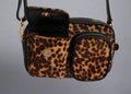 leopard leather dogmom bag, black lambs leather with leopard pony. With shoulder strap. One big compartment with zipper, one small compartment with zipper and hole for poopbags, one small compartment for treats, closes with magnet