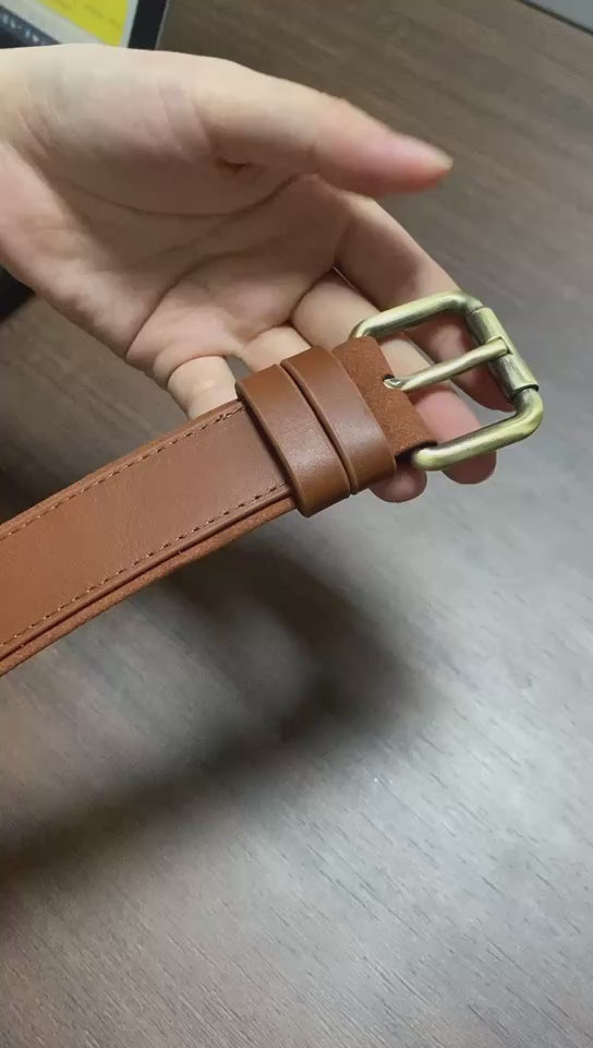 a person is showing details of a leather aritag dog collar