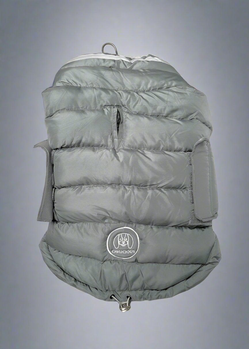 comfortable dog puffer jacket. Closes with a hook-and-loop. Water-and windproof. Opening for leash closes with zipper.