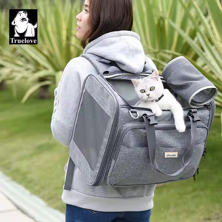 Carry your furry friend in style and comfort with the Truelove 2in1 dog carrier and backpack for small dogs up to 7 kg. Ventilated side panels and waterproof fabric keep your pup cozy and dry, while padded handles and a fleece mat provide added comfort. Perfect for on-the-go adventures!